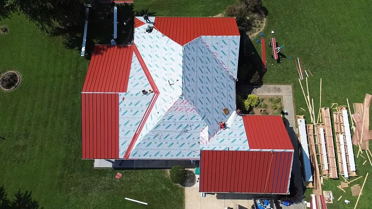 Aerial Drone Red Metal Roof Install St. Charles in St. Charles, MO